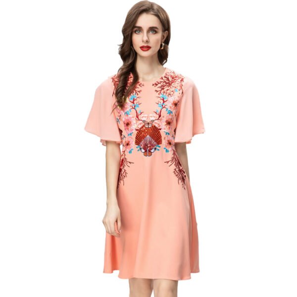 Peach Floral Embroidered Summer Princess Dress 1 Peach Floral Embroidered Summer Princess Dress Model wearing LuckeLadybug embroidered summer princess dress in peach with floral fan embroidery and flutter sleeves on runway