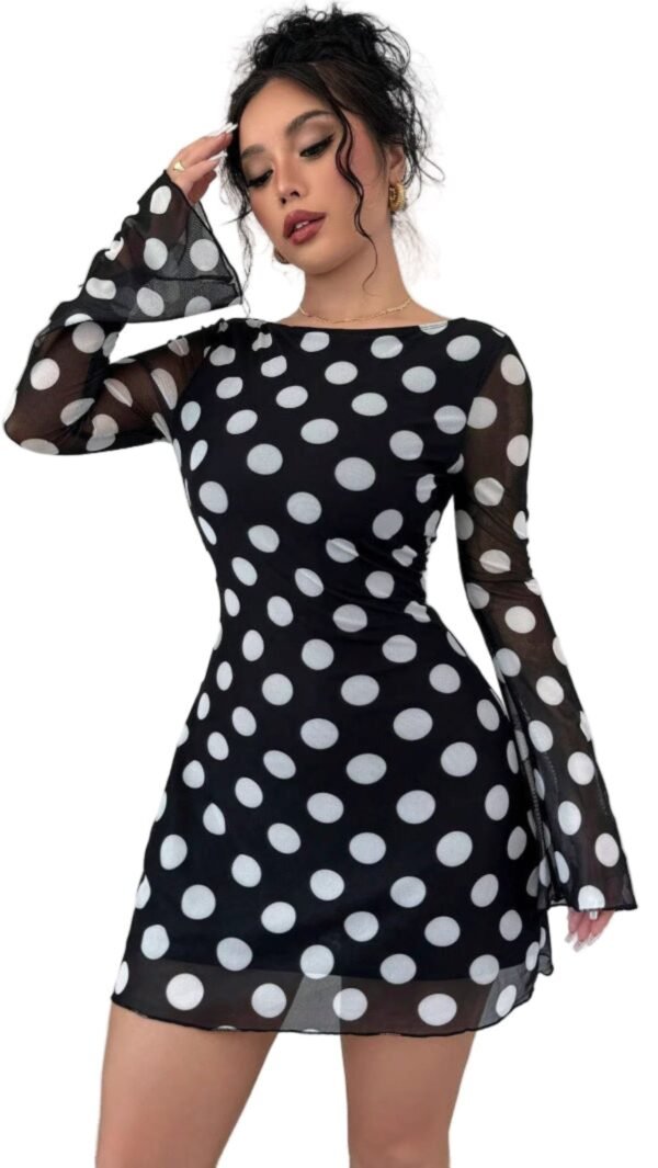 Model in black and white polka dot backless mesh flare sleeve dress sheer bell sleeves and fitted mini silhouette