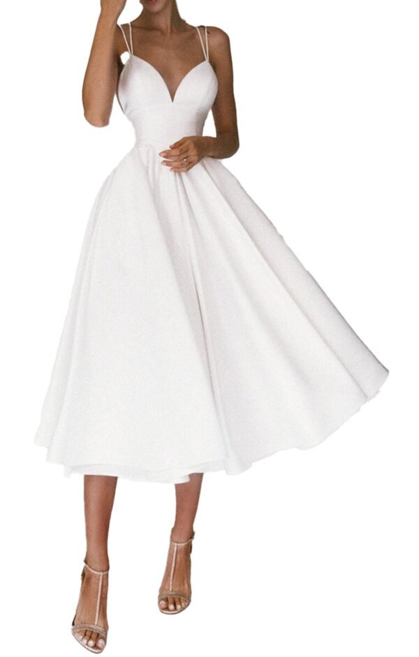 White midi sexy v-neck summer dress with spaghetti straps and full flared skirt on model wearing strappy heels