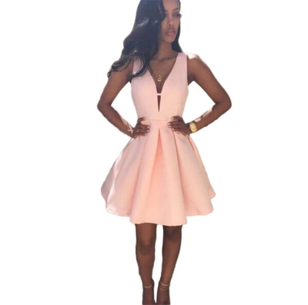 Pink V-Neck Sleeveless Cocktail Mini Dress 2 Pink V-Neck Sleeveless Cocktail Mini Dress LuckeLadybug blush pink v-neck sleeveless cocktail mini dress with fitted waist pleated skirt model wearing heels