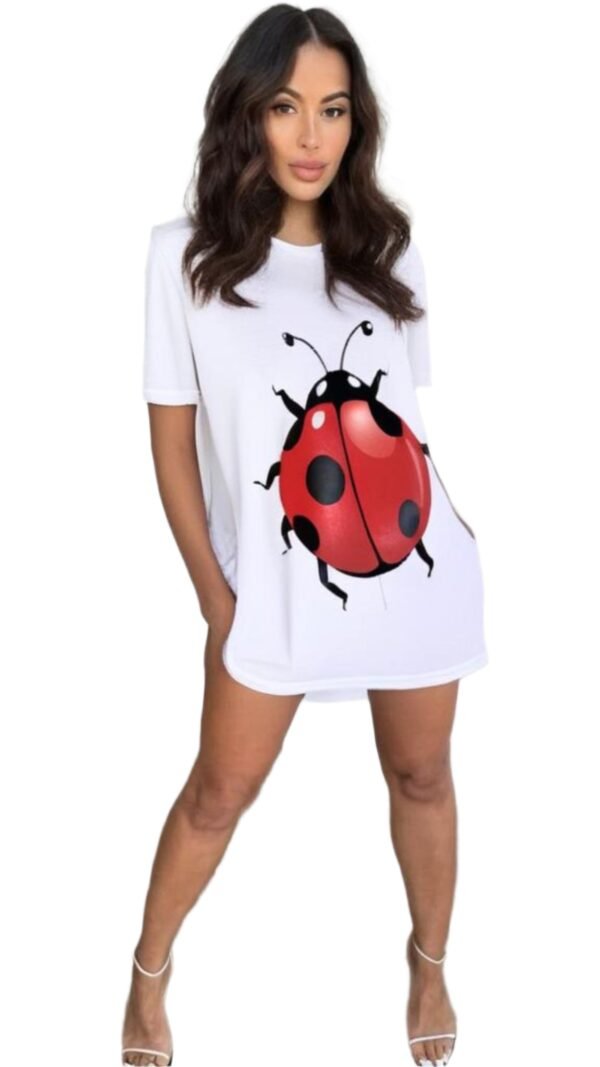 Woman wearing a white cute ladybug t-shirt dress with a large red and black ladybug graphic