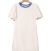 Beige stripe seersucker dress with blue collar and puff sleeves hanging on wooden hanger