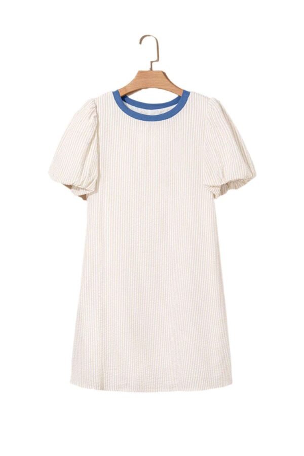 Beige stripe seersucker dress with blue collar and puff sleeves hanging on wooden hanger