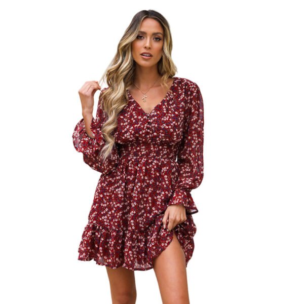 LuckeLadybug model wearing burgundy floral flare sleeve dress with V neck ruffled hem and cinched waist
