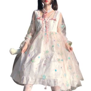 Model wearing Lolita puffy princess dress in pastel pink sheer tulle with floral embroidery bows and lace trim