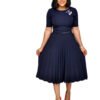 Plus size pleated dress for women in navy blue with belt and floral brooch styled by LuckeLadybug