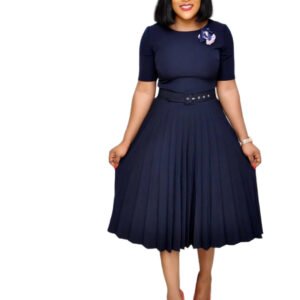 Plus size pleated dress for women in navy blue with belt and floral brooch styled by LuckeLadybug