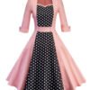 LuckeLadybug pink 1950s style polka dot swing dress for women with black dotted front panel and three quarter sleeves