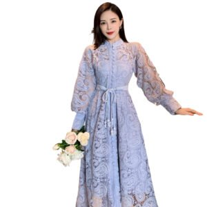 Woman wearing purple lace princess dress with long balloon sleeves and sash holding white rose bouquet in elegant interior