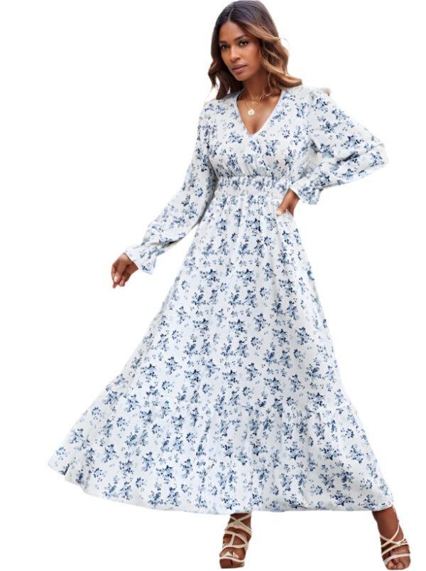 LuckeLadybug shirred waist long dress with blue floral print and long sleeves on a model outdoors