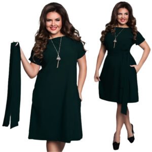 Plus size woman modeling stylish dresses for plus size women in black with belt and necklace