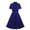 Back view of LuckeLadybug navy collar swing dress with short cuff sleeves fitted waist and full flared skirt