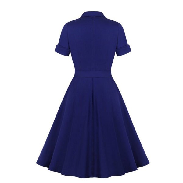 Back view of LuckeLadybug navy collar swing dress with short cuff sleeves fitted waist and full flared skirt